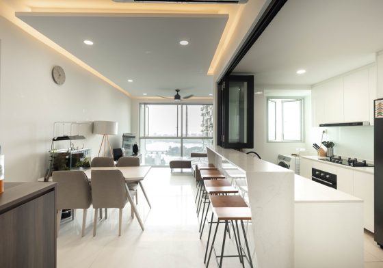 Wide-angle listing photo of an open kitchen and dining area